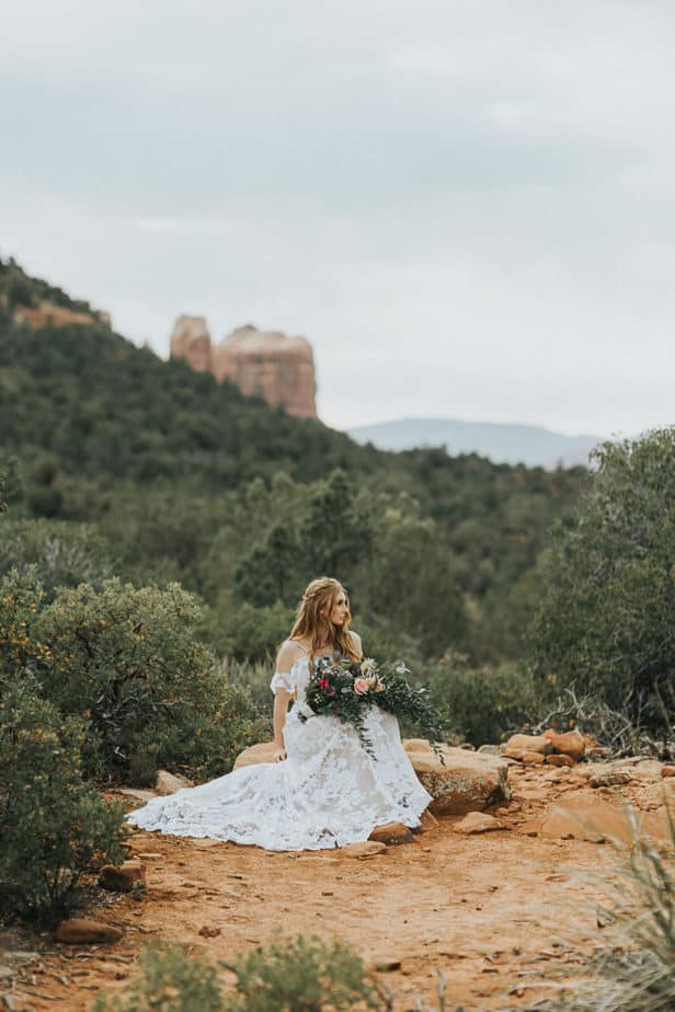 Bride sitting with her bouquet for a portait in Sedona, Arizona.