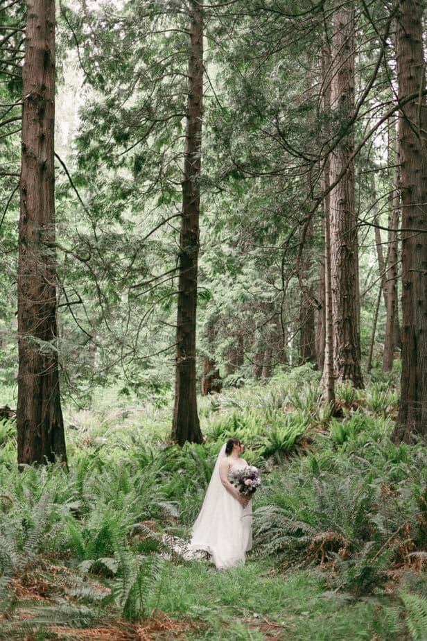 A bride in the woods during her elopement.