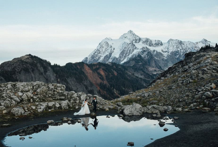 An eloping couple look off into the distance during their North Cascades elopement. 