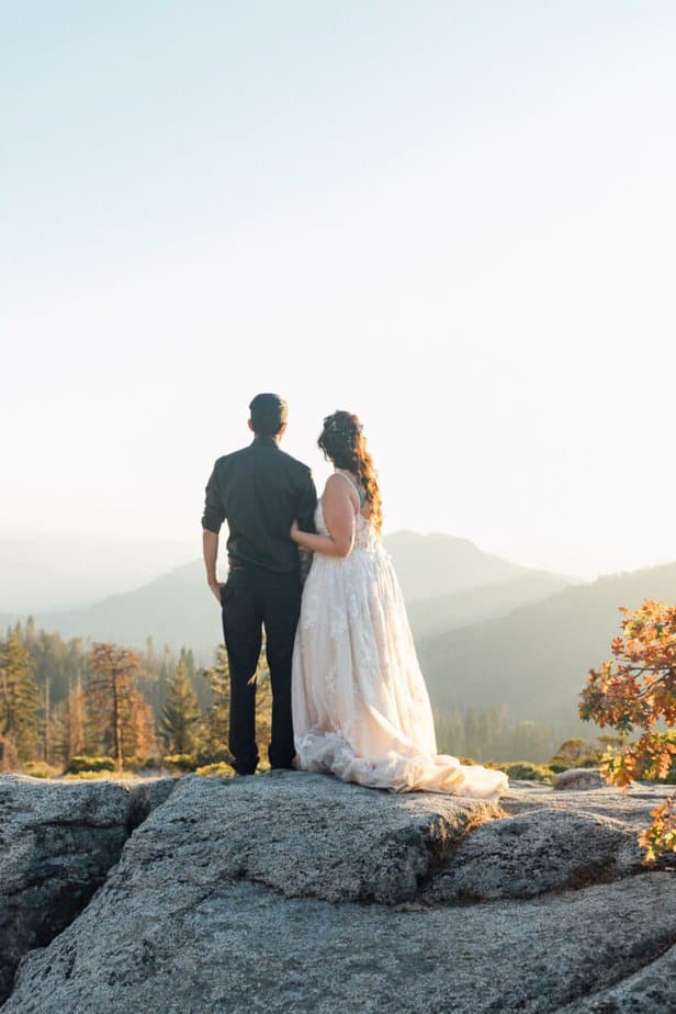 During their mountain elopement, an eloping couple look off into the views of Sequoia & Kings Canyon National Parks.