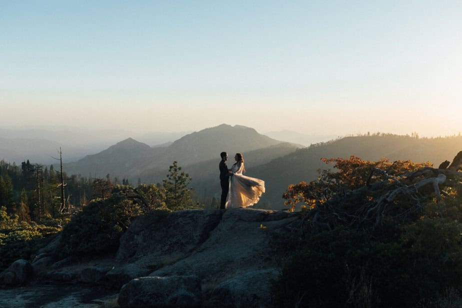 A bride and groom pose for portraits at Beetle Rock in Sequoia National Park in California for their elopement.