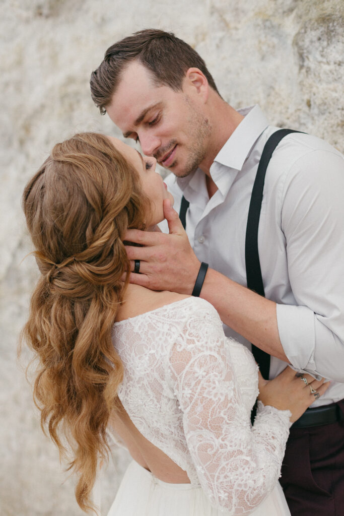 Bride and groom embrace on the beach during their elopement in Coronado, California.