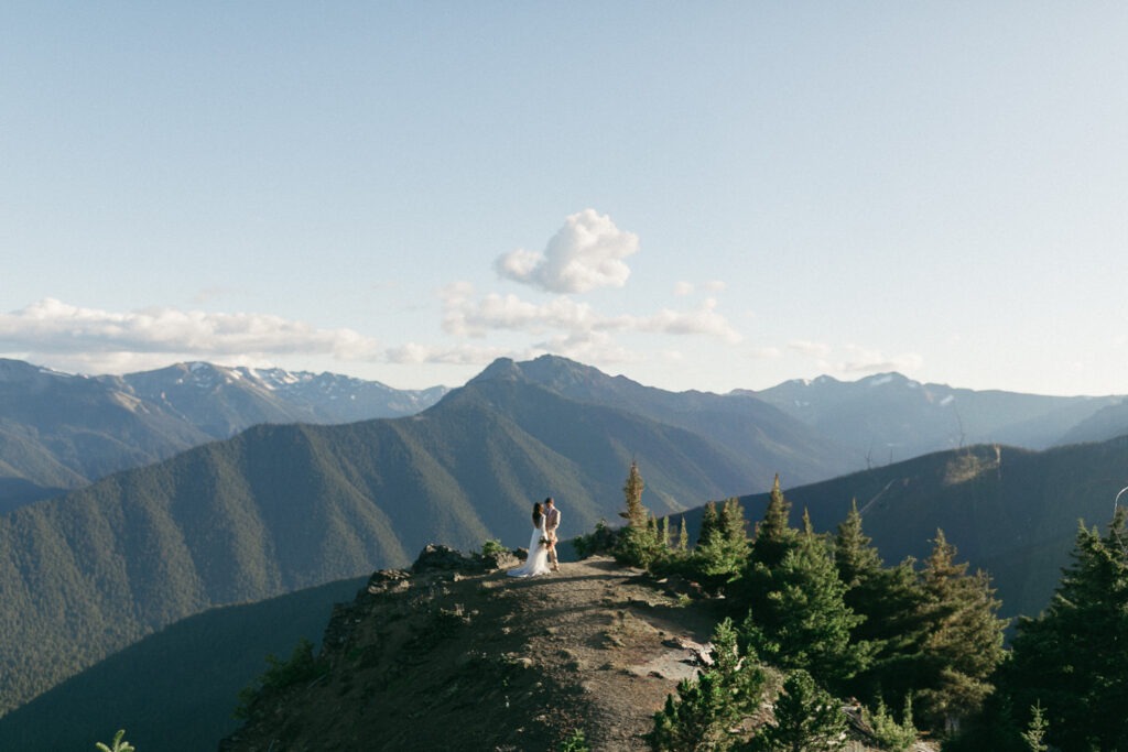 Bride and groom pose in the mountains during their elopement in Port Angeles, Washington.